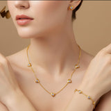 Corazon Brillante™ — Conjunto de Joyería con Corazones Dorados y Circonias Lilas | Collar, Pulsera y Pantallas Stainless Steel